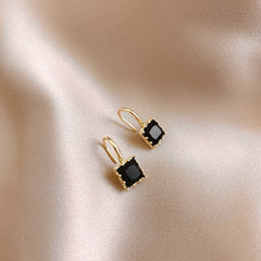 Minimalist Chic: Black White Small Earrings with a Twist